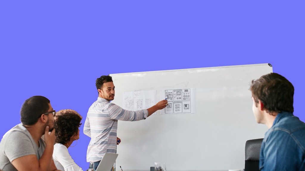 Task Management Software - TasklyHub Man standing at whiteboard